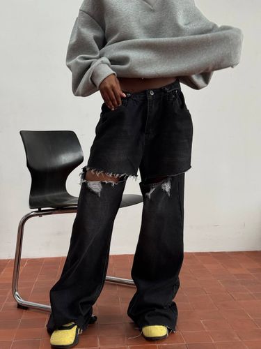 Черные рваные джинсы-трансформеры