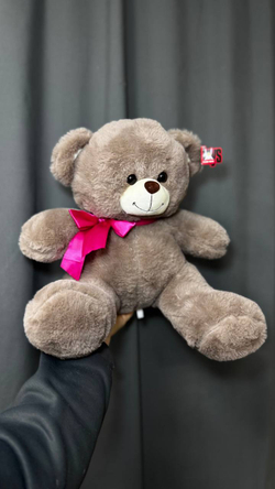 Коричневый мишка с розовым бантом
