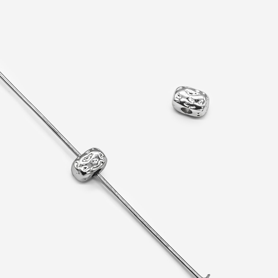 Бусина-разделитель в форме камушка 3,7*5,7мм, родирование