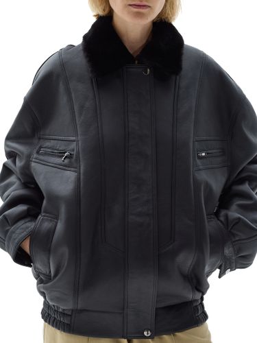 Черная кожаная оверсайз дубленка с отложным воротником