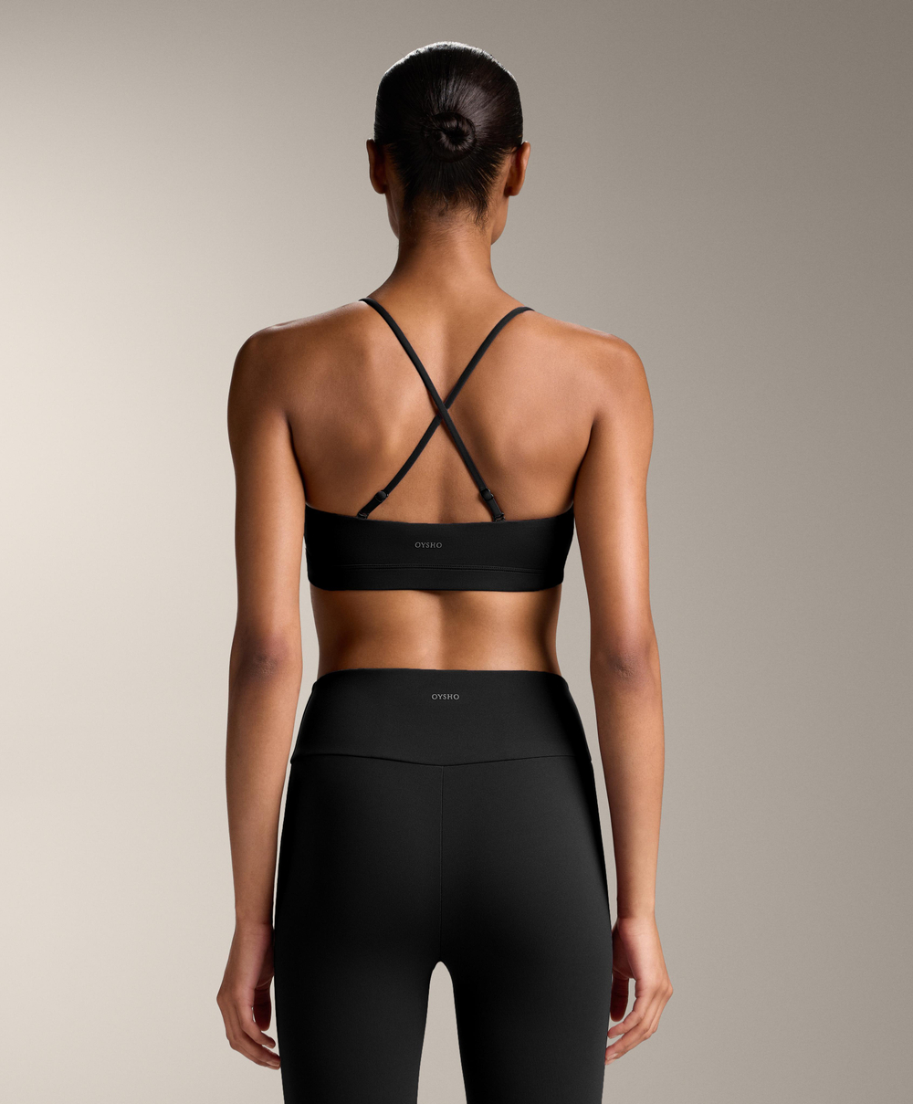 Oysho Спортивный бюстгальтер Comfortlux с перекрещивающимися бретелями и легкой поддержкой, черный
