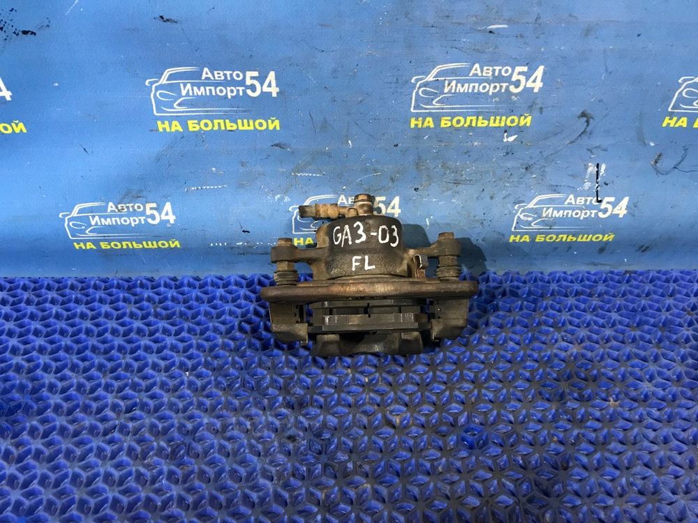 Суппорт тормозной передний левый Honda LOGO 2000