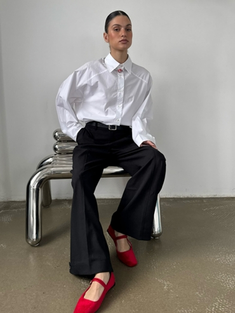 Широкие черные брюки с застежками по низу