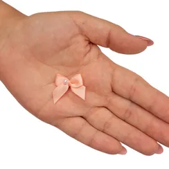 Бантик персик с бусинкой