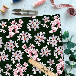 Ткань оксфорд 600 опадающая сакура на тёмно-зелёном фоне