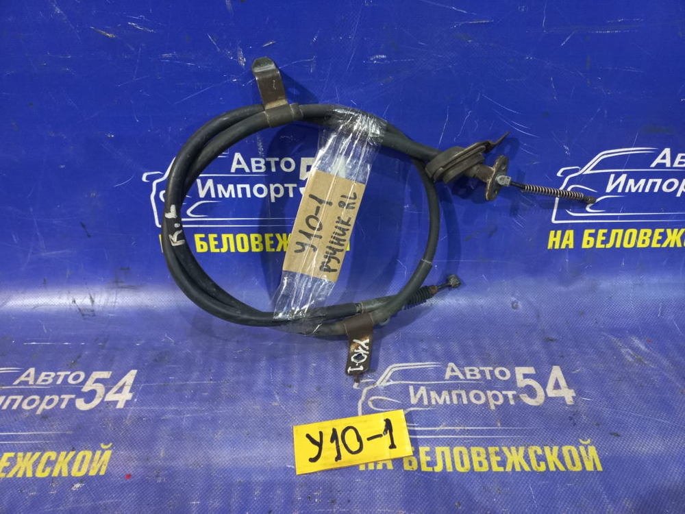 Трос ручника левый NISSAN WINGROAD 1997