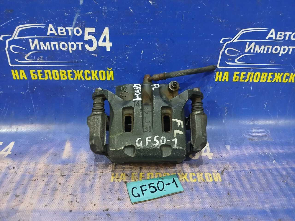 Суппорт тормозной передний левый NISSAN CIMA 2002