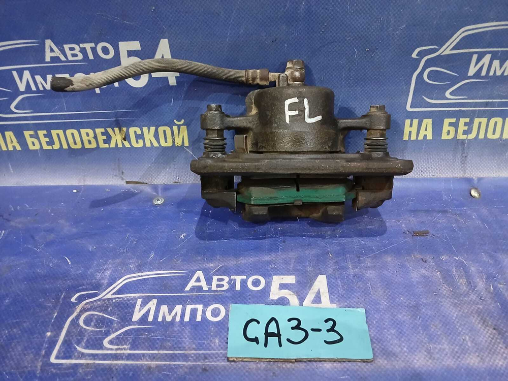 Суппорт тормозной передний левый Honda LOGO 1997