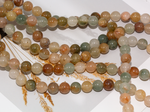 Нить бусин из тонированного кварца 10,5мм