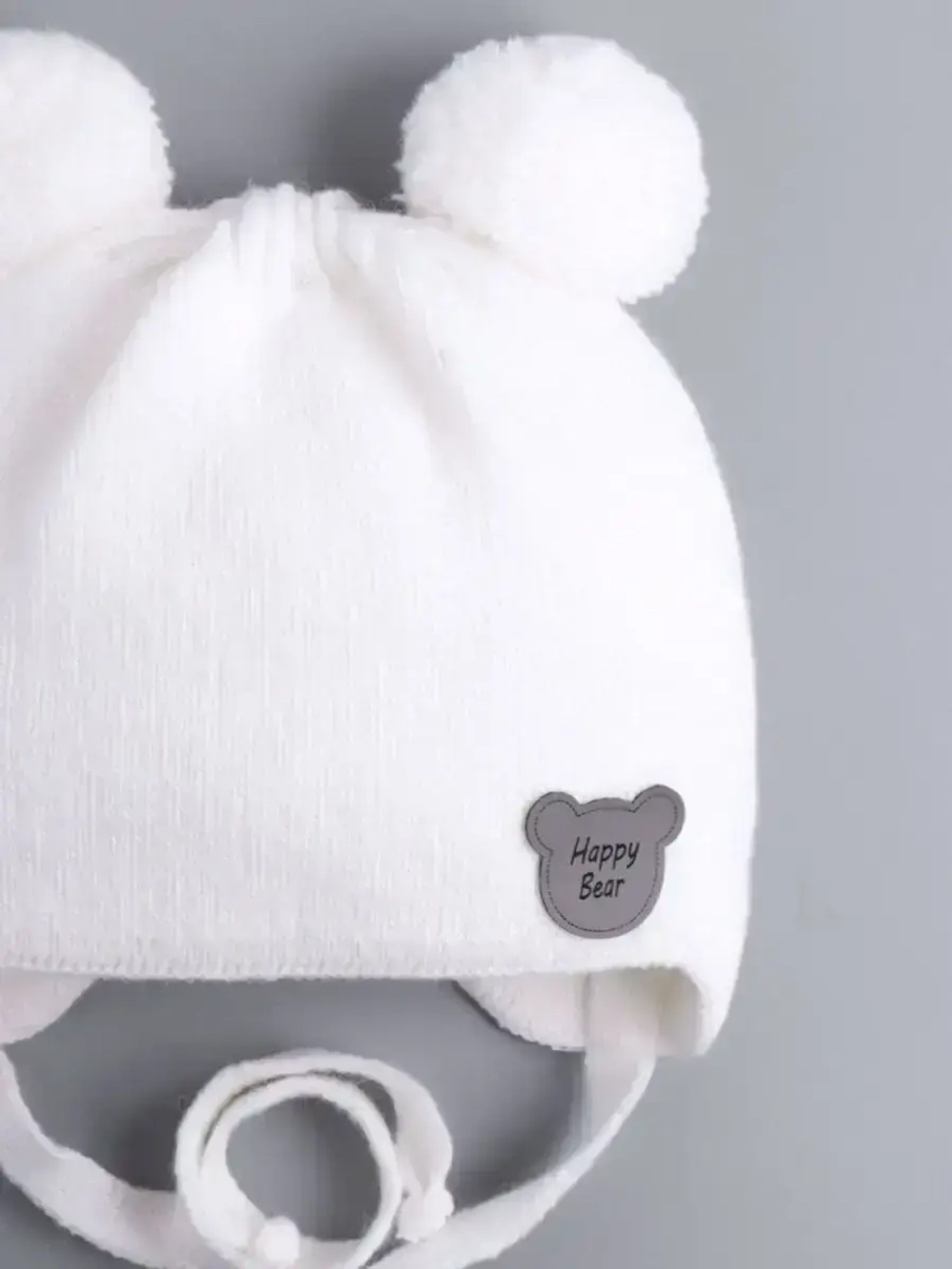 Шапка детская осенняя с завязками и помпонами