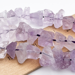 Аметист лавандовый необработанный бусины, размер около 6-9*11-13 мм, цена за 13 шт (1/4 нити)