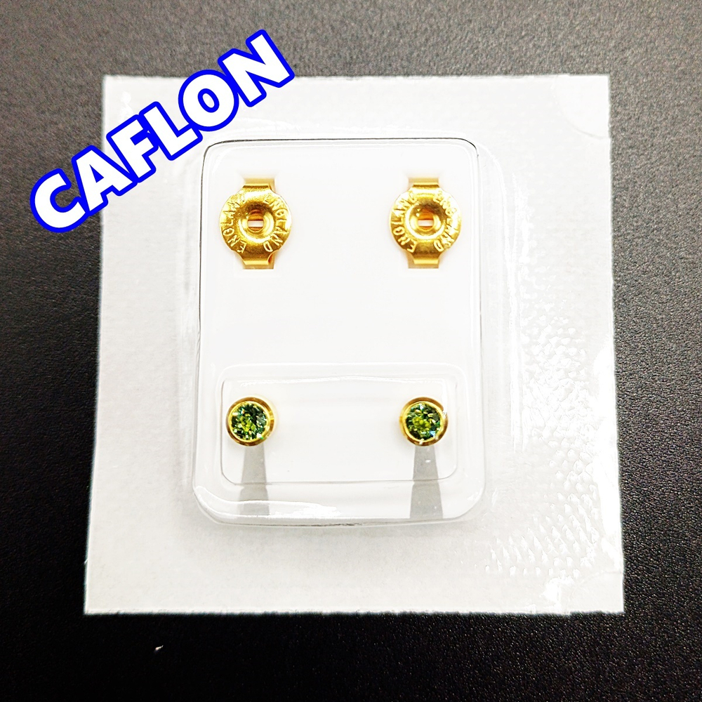 Серьги-гвоздики для прокола ушей под пистолет. CAFLON (Англия). Золотистые с зелеными (Август) кристаллами