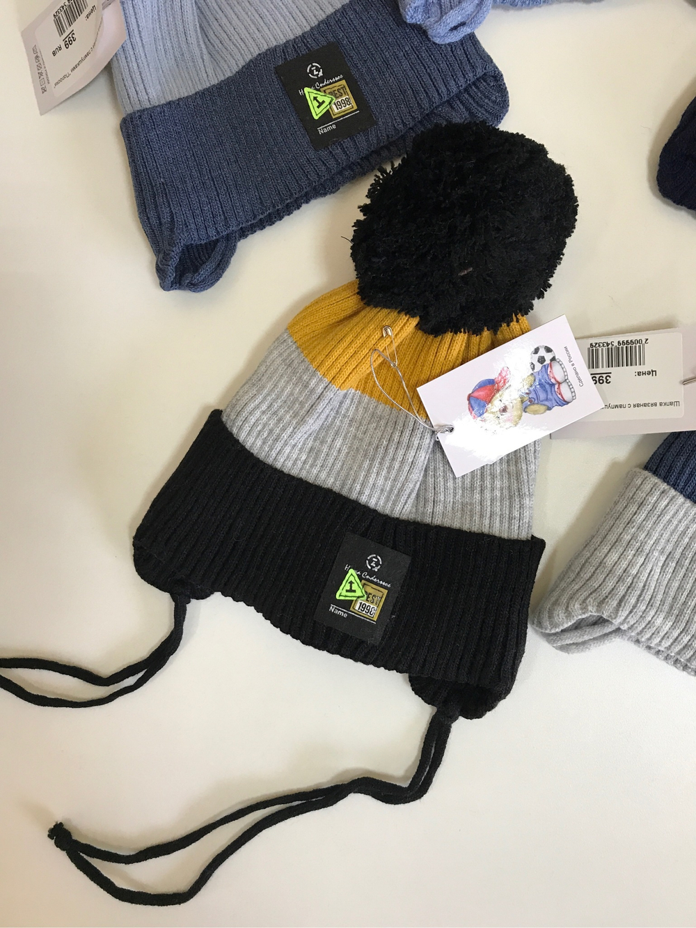 Шапка вязаная с пампушками "Полоски"