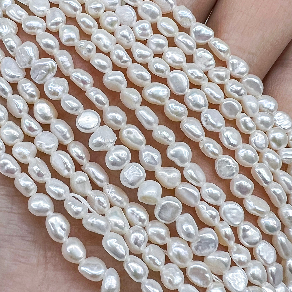 Жемчуг 2А речной бусины 3-4 мм, на нитке 38 см