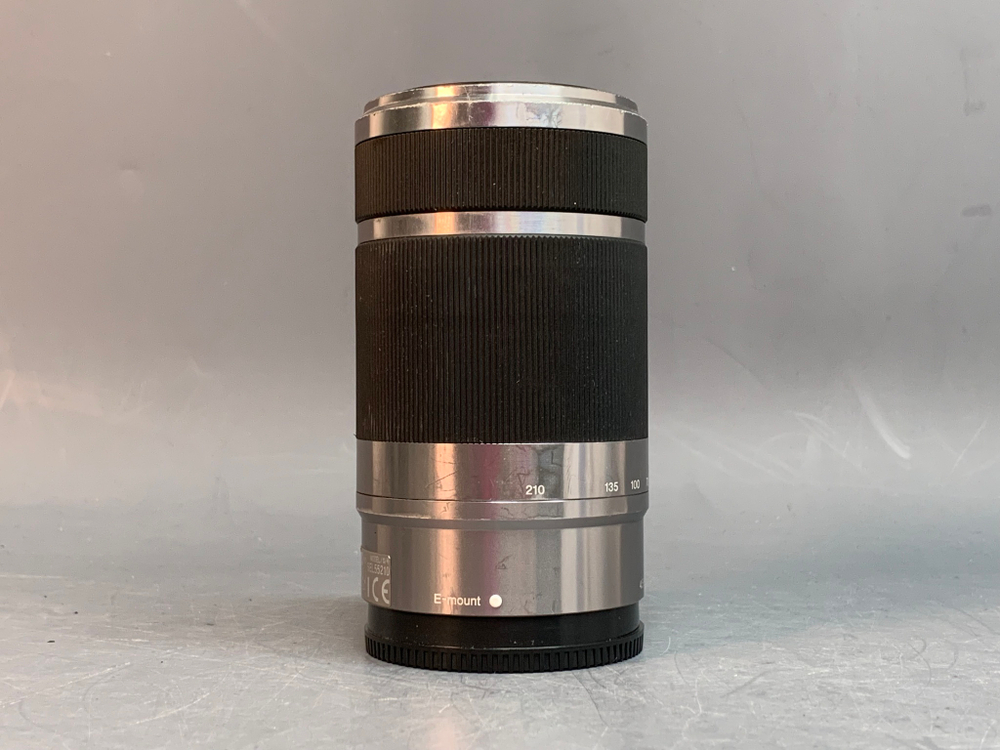 Sony 55-210mm f/4.5-6.3 E OSS внутри налет в виде точек