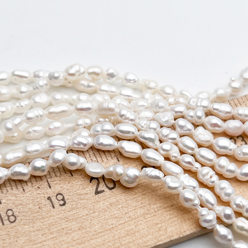 Жемчуг Микро рис бусины, размер около 4-4,5*2,8-3,5 мм, цена за нить 36 см