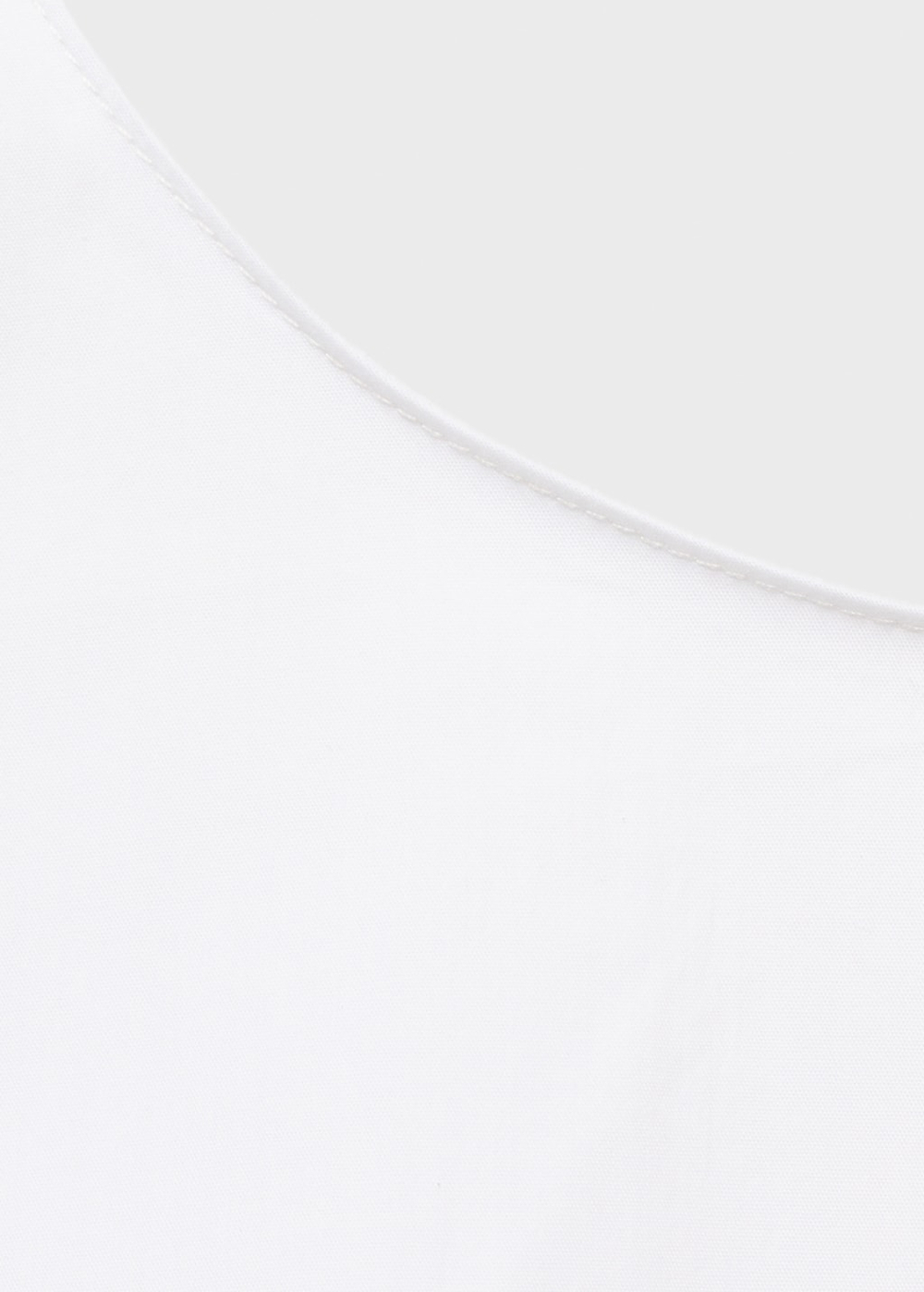 Укороченный топ с бантом на спине