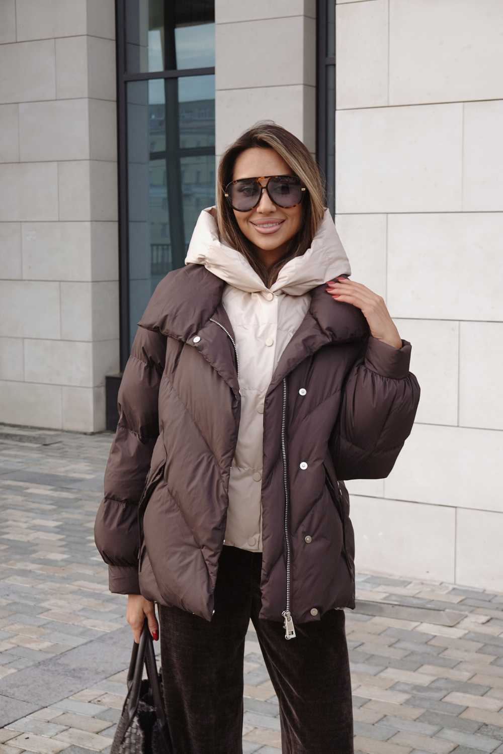 Пуховик средней длины с декором на карманах