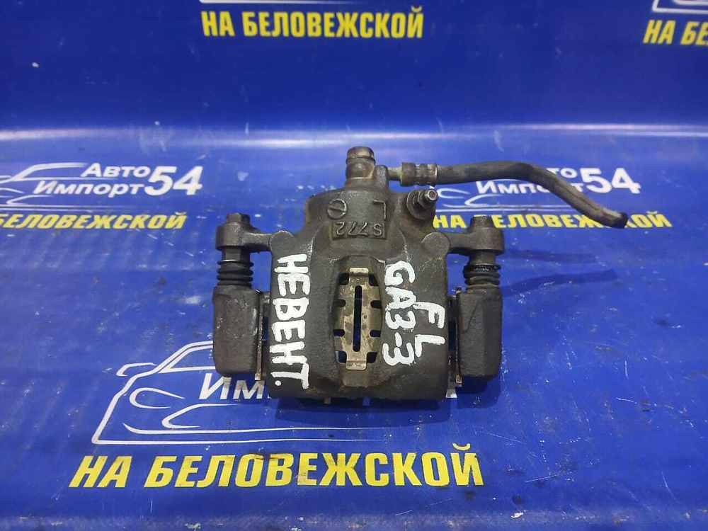 Суппорт тормозной передний левый Honda LOGO 1997