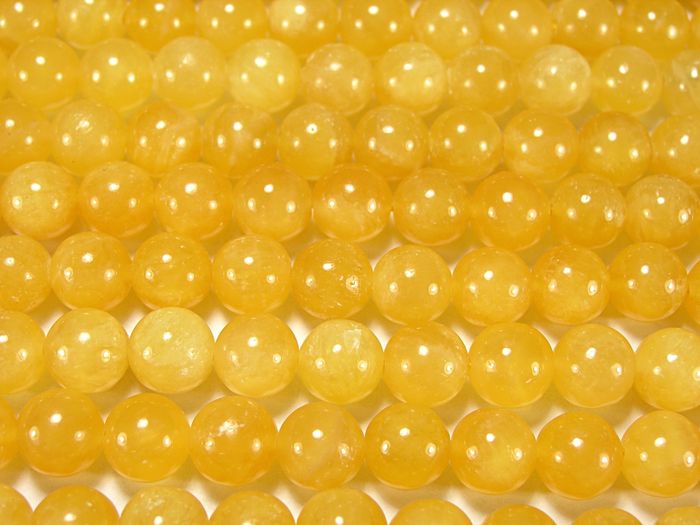 Нити бусин из кальцита желтого, шар гладкий 10мм (оптом)