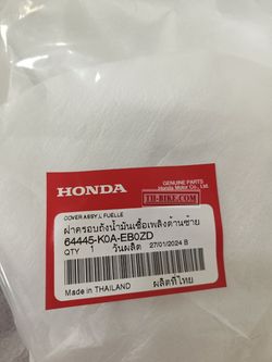 64445-K0A-EB0ZD. COVER ASSY., L. FUEL TANK (WL). HONDA