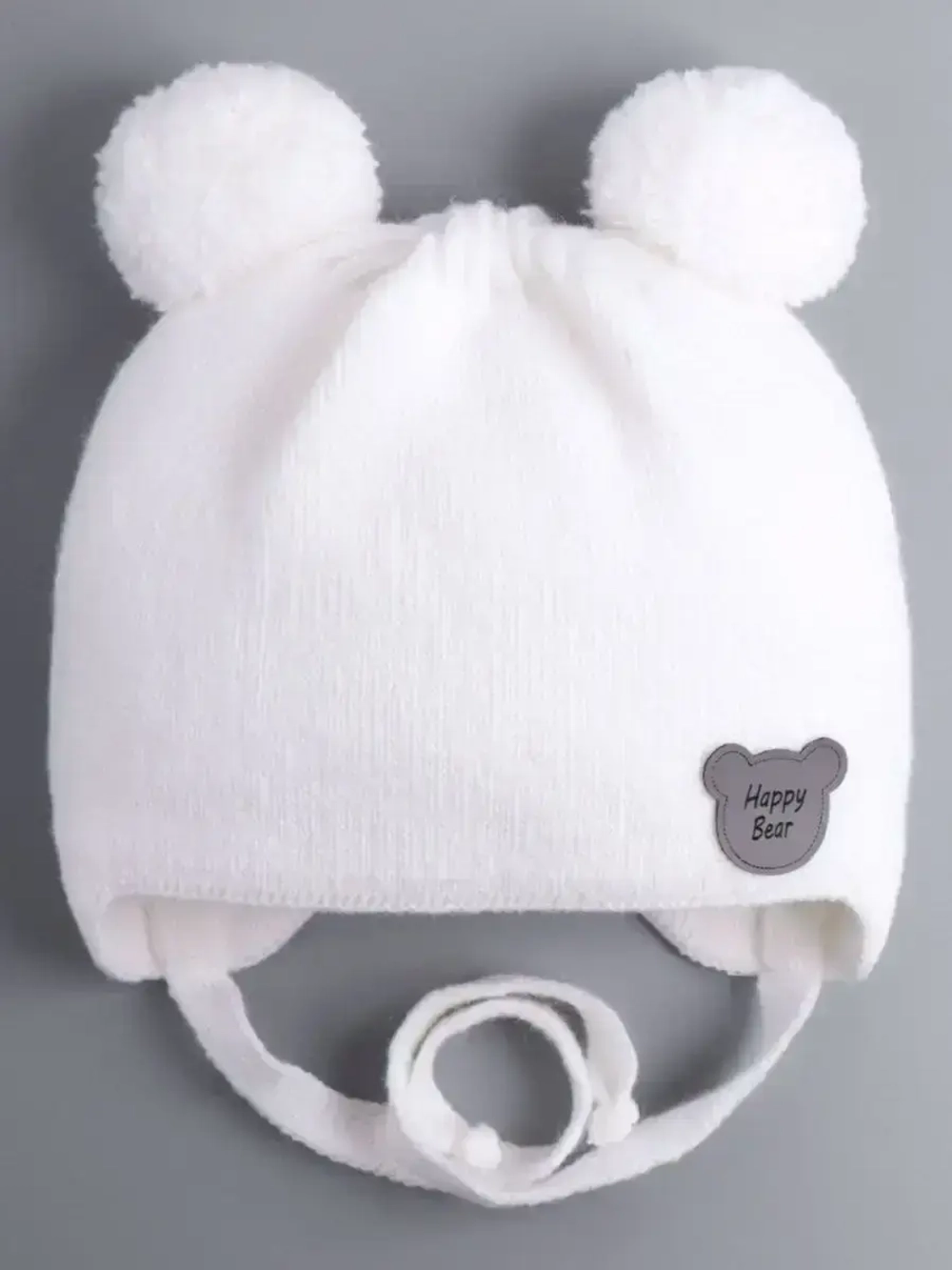 Шапка детская осенняя с завязками и помпонами