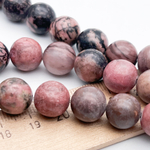 Родонит бусины, диаметр около 11,9-12,2 мм, цена за 7-8 шт (1/4 нити)