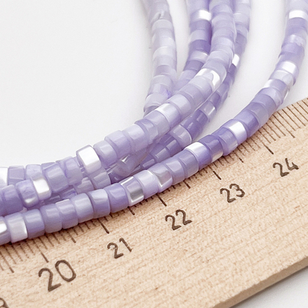 Перламутр тонированный, цвет сиреневый, размер 4*2,5 мм, цена за отрезок 19 см (1/2 нити)