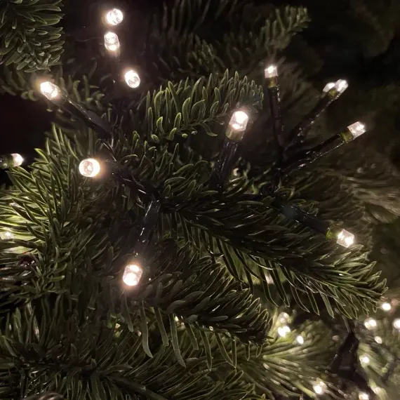 Светодиодная нить Snake Light 700 теплых белых ламп, 14 м., 24В, 8 режимов, зеленый провод, для елки 215 см., Christmas DeLuxe (83782)