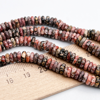 Риолит бусины, рондель, размер около 1,8-2,5*5,5-6 мм, цена за отрезок 19 см (1/2 нити)