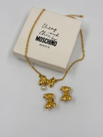 Комплект из клипс и кулона в виде бантиков Moschino