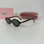 Солнцезащитные очки Miu Miu