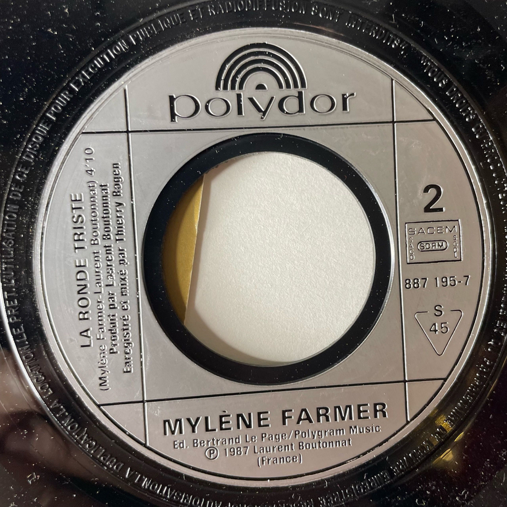 Винтажная виниловая пластинка 7 дюймов (маленькая пластинка) Mylene Farmer Sans Contrefacon (Франция 1987)