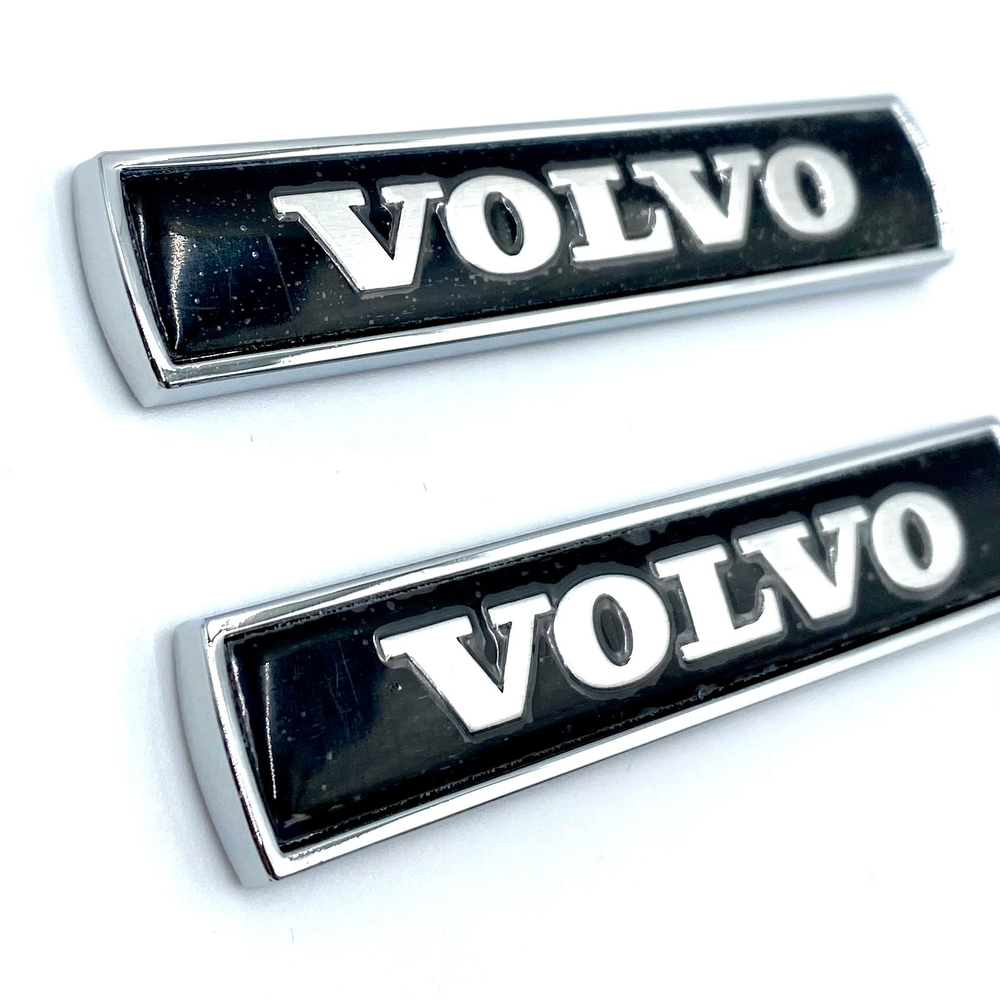Шильд Volvo объемный металлический (наклейка Вольво, 7,5х1,5см). 2 шт в комплекте. Черный цвет с серебристой надписью