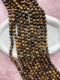 Нить бусин тигрового глаза 10,5мм