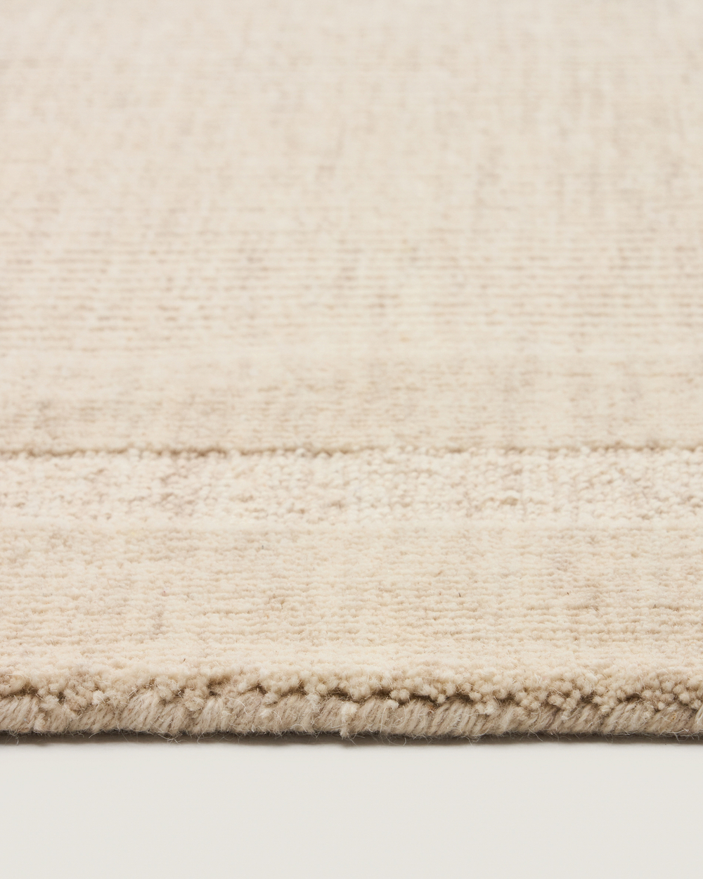 Жаккардовый шерстяной ковер Dalena в бежевую полоску 230 x 160 см