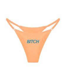 трусы стринги шелковые с надписью Bitch персиковые