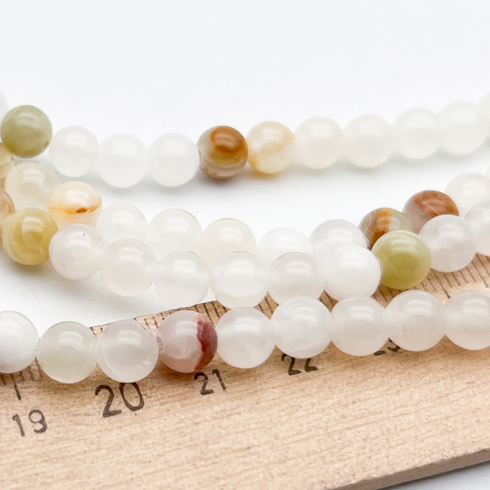 Кальцит бусины, диаметр около 6,4-6,6 мм, цена за 32-33 шт (1/2 нити)