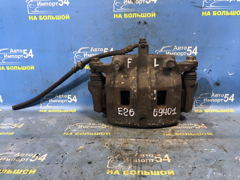 Суппорт тормозной передний левый NISSAN CARAVAN 2012-2017