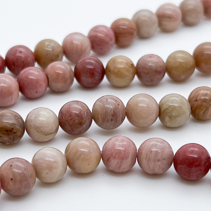 «Родонит» (мусковит с альбитом и кварцем, тонированный), диаметр 7,8-8,1 мм, цена за 23-24 шт (1/2 нити)