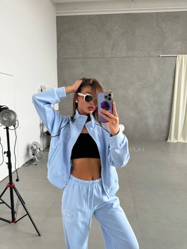 Голубой костюм с вышивкой-лого