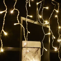 ULD-B6007-200-STK WARM WHITE IP44 Бахрома светодиодная со статическим свечением. 6м. Соединяемая. 200 светодиодов. Теплый белый свет. Провод прозрачный. ТМ Uniel