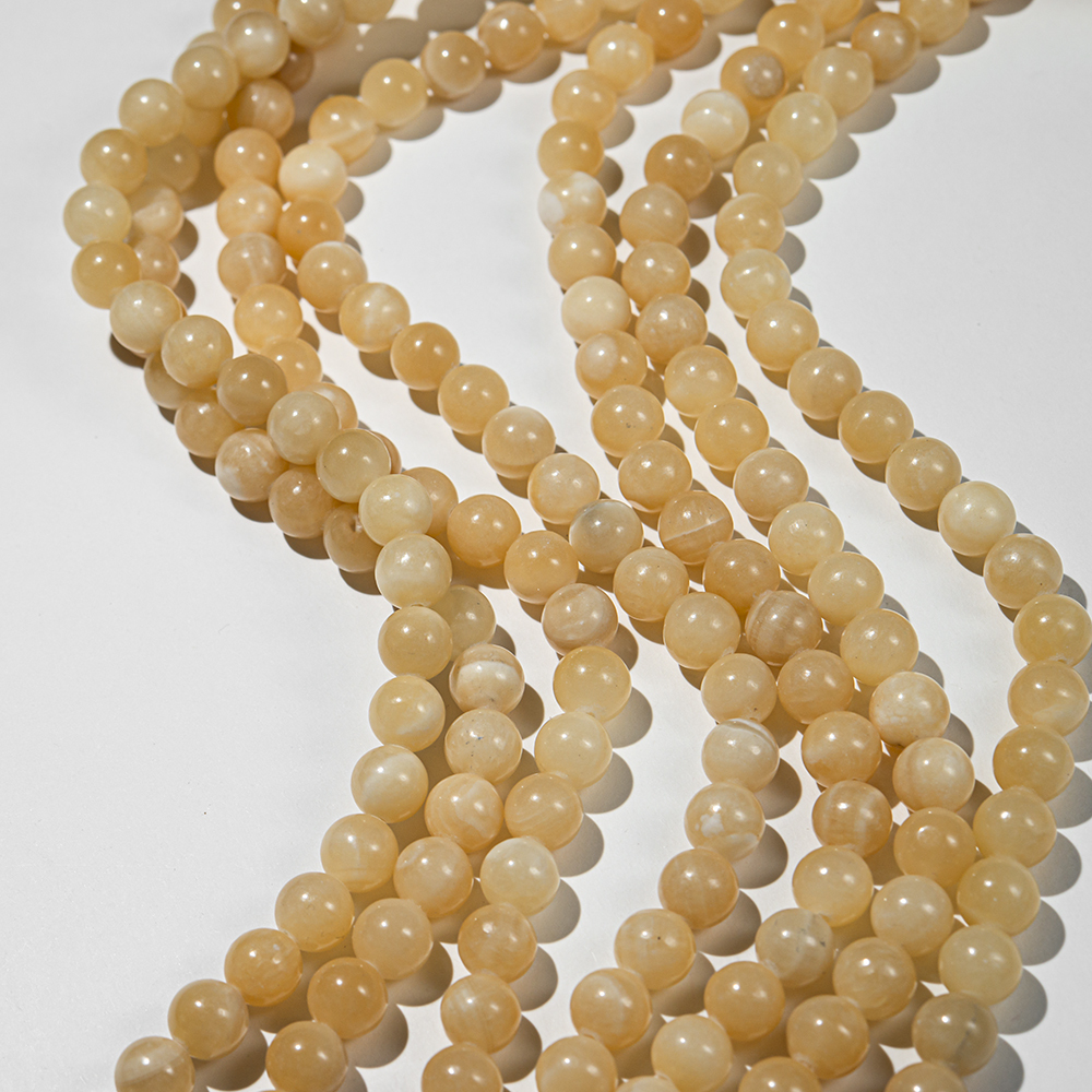 жк-10 Желтый кальцит шар гладкий 10,2мм, нить 37см
