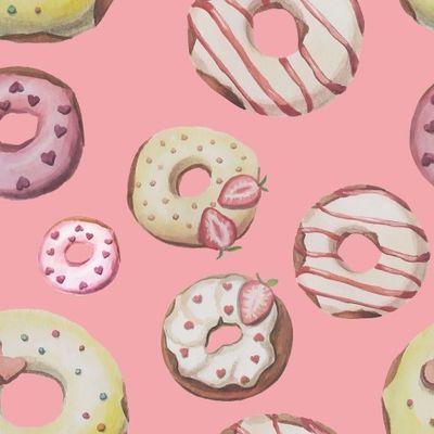 Крупные пончики на розовом фоне