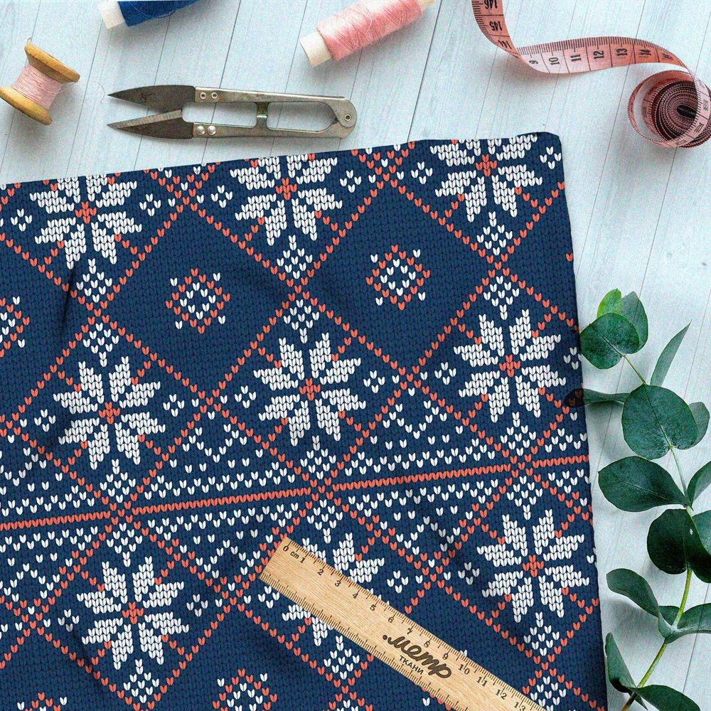 Ткань оксфорд 210 красно-белая вышивка на синем свитере