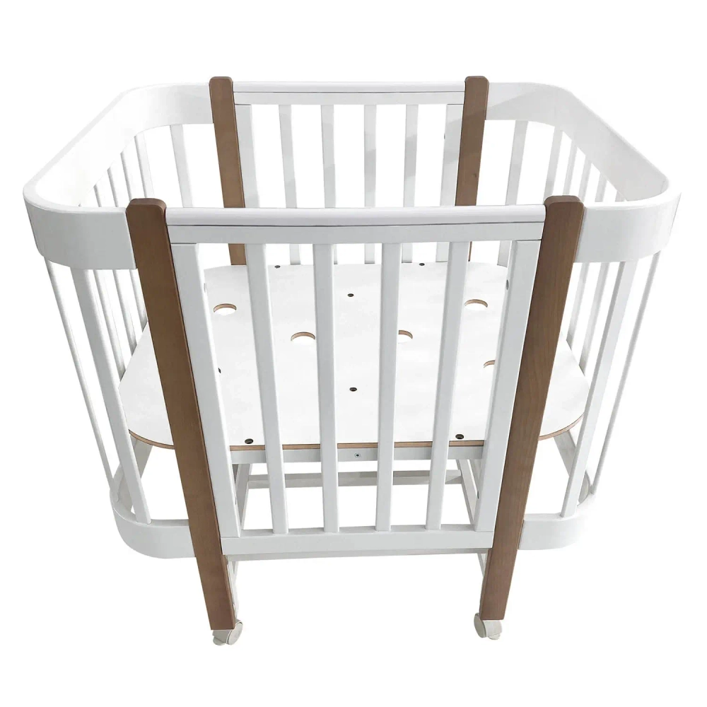 Кровать детская Indigo Italiano Baby продольный маятник на колесах белый-натуральный