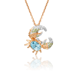 Подвеска «Краб» из красного золота с топазами и хризолитами