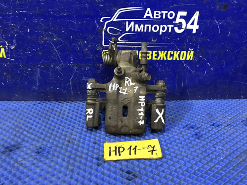 Суппорт тормозной задний левый NISSAN PRIMERA 1998