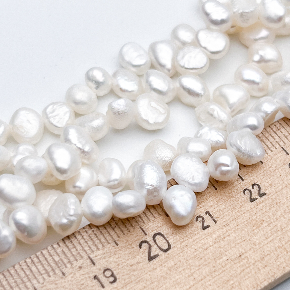 Жемчуг, размер около 6,5-7*5-5,5 мм, цена за отрезок 17 см (1/2 нити)