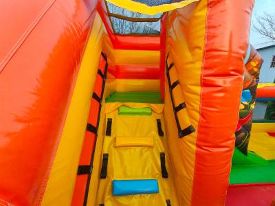 Коммерческий надувной батут «Весёлые динозаврики» с горкой, 5*4*2,8 м